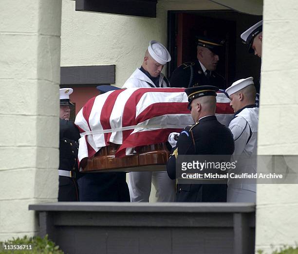 Military pallbearers carry the coffin of former President Ronald Reagan to the hearse at Gates Kingsley and Gates Moeller Murphy funeral home in...