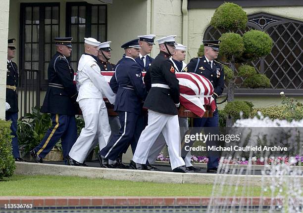 Military pallbearers carry the coffin of former President Ronald Reagan to the hearse at Gates Kingsley and Gates Moeller Murphy funeral home in...