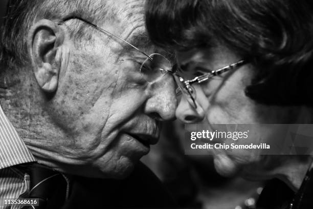 Senate Judiciary Committee Chairman Charles Grassley and raking member Sen. Dianne Feinstein talk during a mark up hearing about Supreme Court...