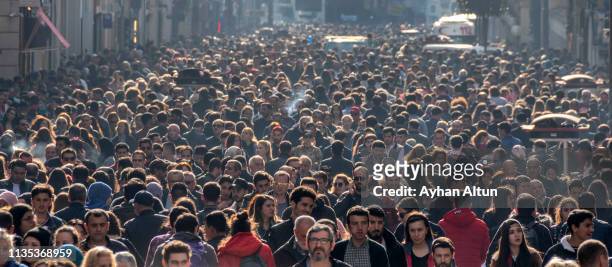 famous istiklal street in beyoglu district of istanbul,turkey - crowd of people walking stock pictures, royalty-free photos & images