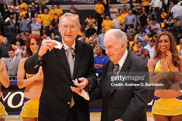 Bill Sharman is honored with a championship ring by American Basketball Association executive Dennis Murphy for coaching the Utah Stars to the 1971...