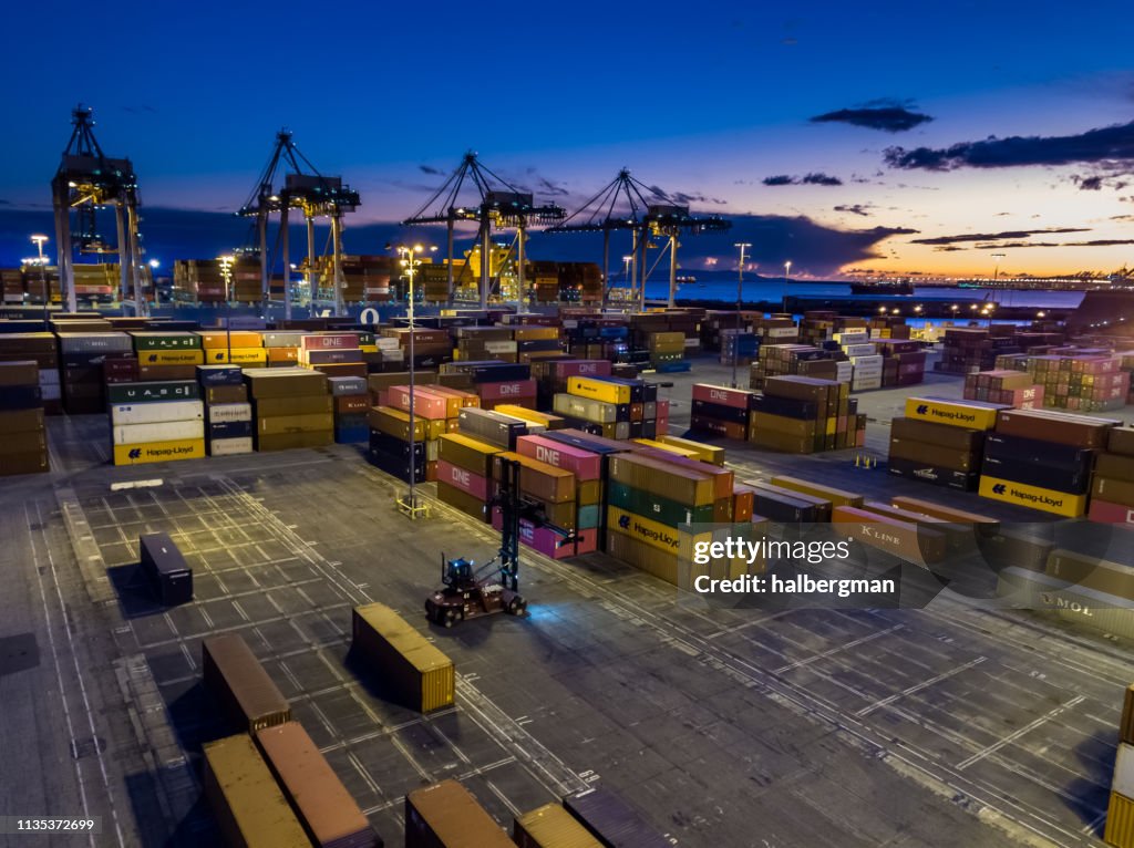 Dramatic Aerial of Container Terminal and Ships at Twilight