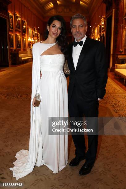 Amal Clooney and George Clooney attend a dinner to celebrate The Prince's Trust, hosted by Prince Charles, Prince of Wales at Buckingham Palace on...