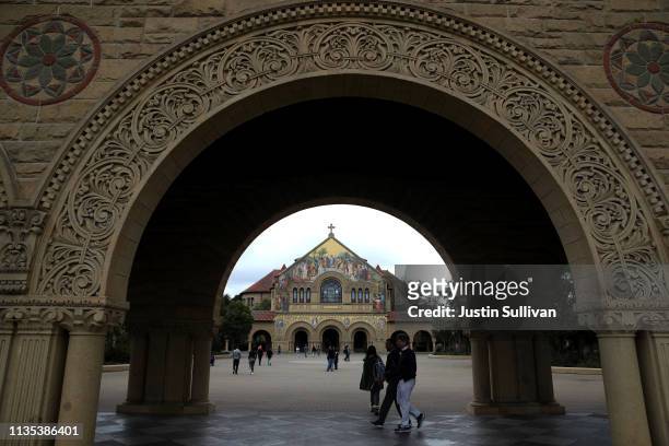 Students and visitors walk on the Stanford University campus on March 12, 2019 in Stanford, California. More than 40 people, including actresses Lori...