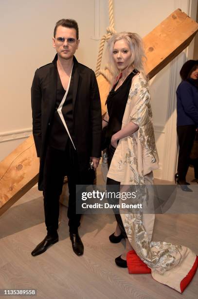 Carlo Brandelli and Ewa Wilczynski attend 'Tribute To Mono-Ha' at the Cardi Gallery on March 12, 2019 in London, England.