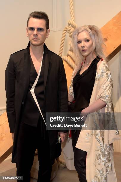 Carlo Brandelli and Ewa Wilczynski attend 'Tribute To Mono-Ha' at the Cardi Gallery on March 12, 2019 in London, England.