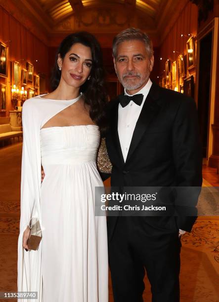 Amal Clooney and George Clooney attend a dinner to celebrate The Prince's Trust, hosted by Prince Charles, Prince of Wales at Buckingham Palace on...