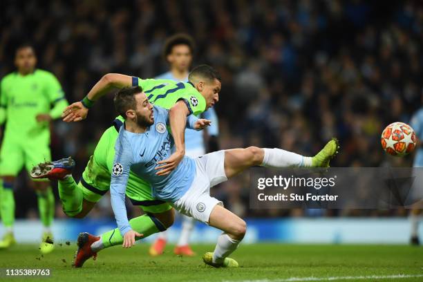 Jeffrey Bruma of Schalke 04 fouls Bernardo Silva of Manchester City which leads to a penalty being awarded during the UEFA Champions League Round of...