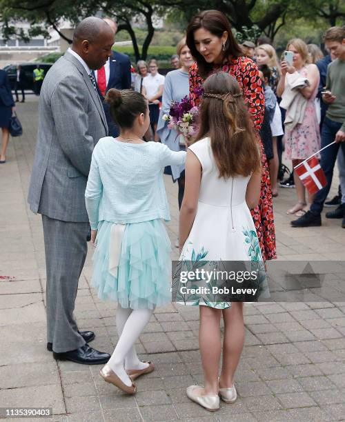 Mary, Crown Princess of Denmark and Mayor Sylvester Turner greet flower girls on a visit on March 12, 2019 in Houston,Texas .