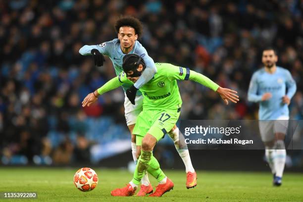 Leroy Sane of Manchester City battles for possession with Benjamin Stambouli of FC Shalke 04 during the UEFA Champions League Round of 16 Second Leg...