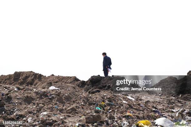 Government official inspects the crash site of Ethiopian Airlines Flight ET 302 on March 12, 2019 in Bishoftu, Ethiopia. All 157 passengers and crew...