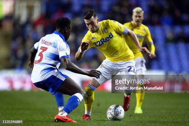 Andy Yiadom of Reading challenges Jack Harrison of Leeds United during the Sky Bet Championship match between Reading and Leeds United at the...