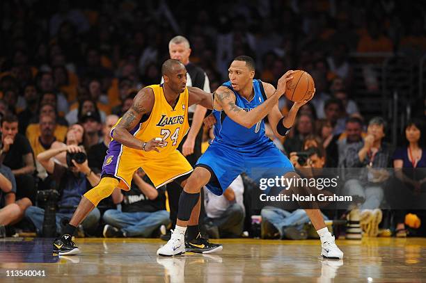 Shawn Marion of the Dallas Mavericks holds the ball against Kobe Bryant of the Los Angeles Lakers in Game One of the Western Conference Semifinals in...