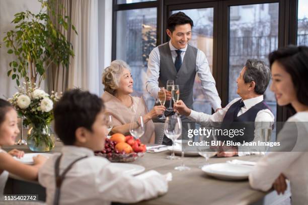 noble family eating holiday meal together - victory dinner stockfoto's en -beelden