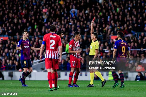 The referee Gil Manzano shows red card to Diego Costa of Atletico de Madrid during the of La Liga match between FC Barcelona and Atletico de Madrid...