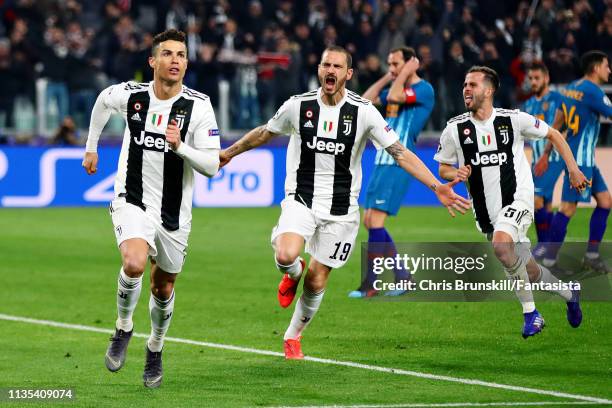 Cristiano Ronaldo of Juventus celebrates scoring his sides third goal from the penalty spot during the UEFA Champions League Round of 16 Second Leg...