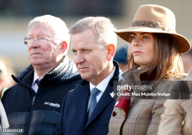 Sir Alex Ferguson and Jeremy Kyle watch the racing on day 1 'Champion Day' of the Cheltenham Festival at Cheltenham Racecourse on March 12, 2019 in...