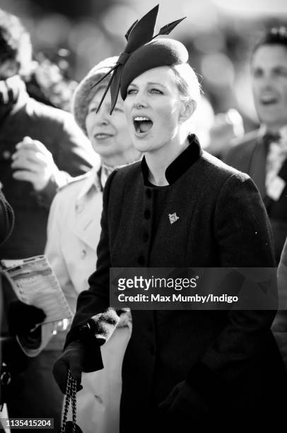Princess Anne, Princess Royal and Zara Tindall watch the racing as they attend day 1 'Champion Day' of the Cheltenham Festival at Cheltenham...
