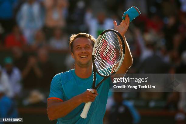 Philipp Kohlschreiber of Germany celebrates his men’s singles third round match victory against Novak Djokovic of Serbia on Day 9 of the BNP Paribas...