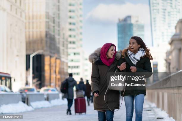 adult female friends walking through the city - daily life in toronto stock pictures, royalty-free photos & images