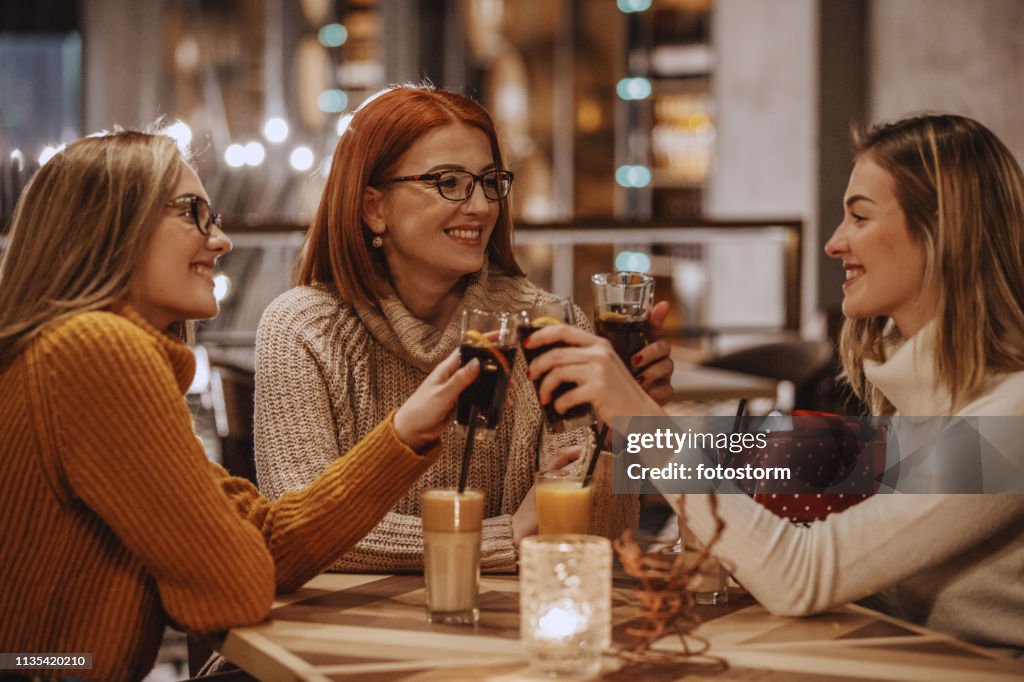 Women toasting with coke