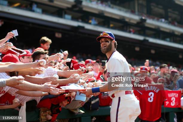 Bryce Harper of the Philadelphia Phillies signs autographs prior to the game between the Minnesota Twins and the Philadelphia Phillies at Citizens...