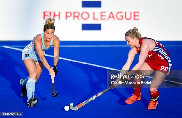 Agustina Albertarrio of Argentina competes for the ball with Hollie Pearne-Webb of Great Britain during the Women's FIH Field Hockey Pro League match...