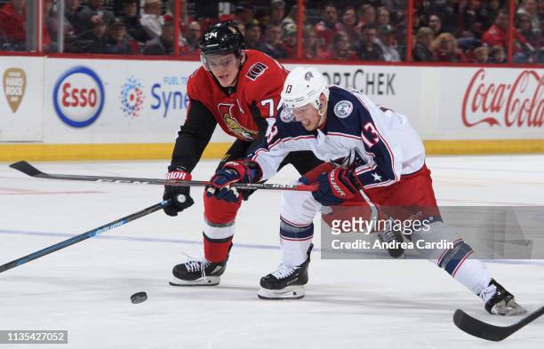 Mark Borowiecki of the Ottawa Senators battles for the puck with Cam Atkinson of the Columbus Blue Jackets at Canadian Tire Centre on April 6, 2019...