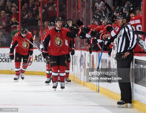 Thomas Chabot of the Ottawa Senators high fives the bench after scoring a second period goal on the Columbus Blue Jackets at Canadian Tire Centre on...