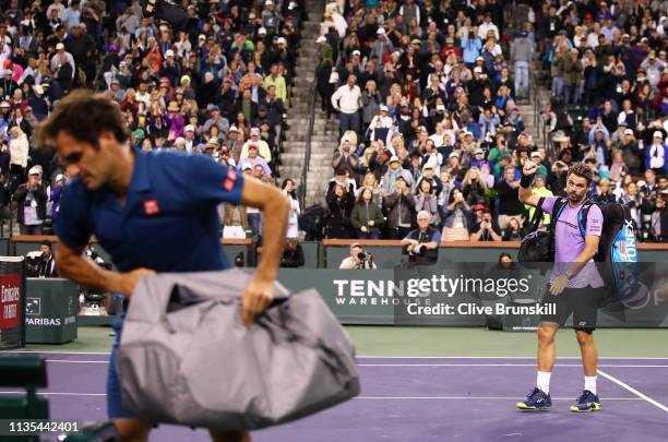 Stan Wawrinka of Switzerland shows his dejection as he walks off court after his straight sets defeat against Roger Federer of Switzerland during...