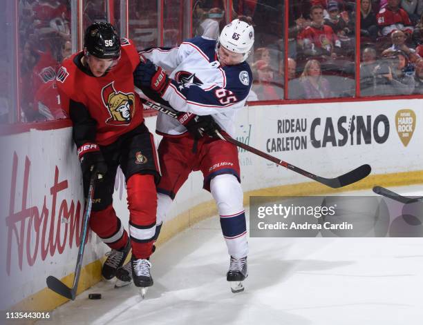Magnus Paajarvi of the Ottawa Senators battles for the puck along the boards with Markus Nutivaara the Columbus Blue Jackets at Canadian Tire Centre...