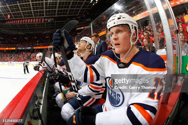 Colby Cave of the Edmonton Oilers sits on the bench during an NHL game against the Calgary Flames on April 6, 2019 at the Scotiabank Saddledome in...