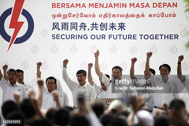 Prime Minster and the Secretary General of the People's Action Party, Lee Hsien Loong leads the cheer, " Majulah PAP, Majulah Singapura" together...