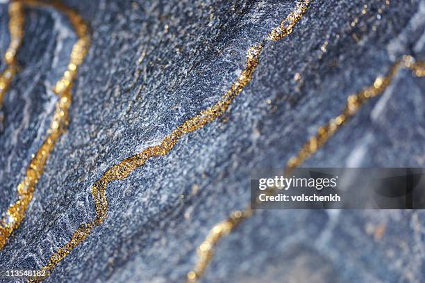 gold verzierten rock - gold edelmetall stock-fotos und bilder