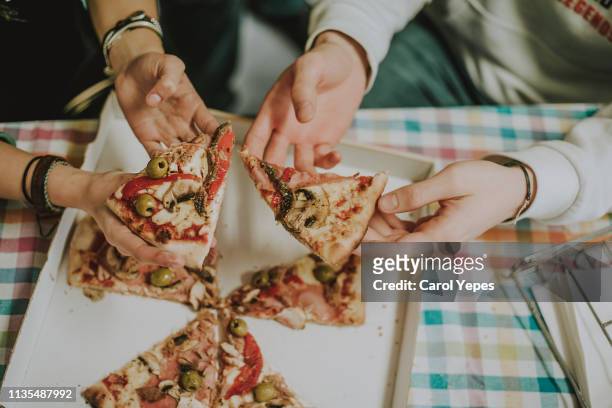 top view people grabbing pizza slices - cheese top view stockfoto's en -beelden