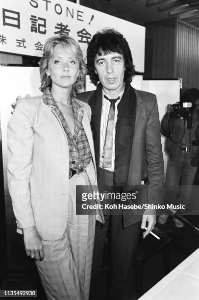 Bill Wyman of the Rolling Stones with Astrid Lindstrom, while promoting his solo album 'Bill Wyman', Hotel Okura, Tokyo, Japan, 25th March 1982.