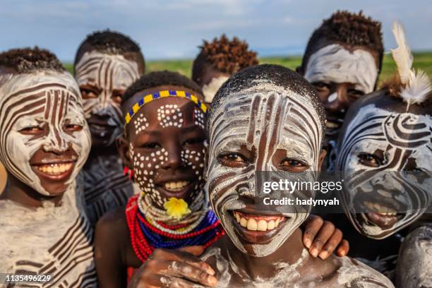 group of happy african children, east africa - body art stock pictures, royalty-free photos & images