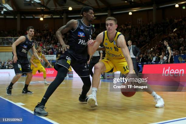 Sherman Gay Hakro Merlins and Tim Schneier of Alba Berlin battle for the ball during the match between Hakro Merlins and Alba Berlin on April 06,...