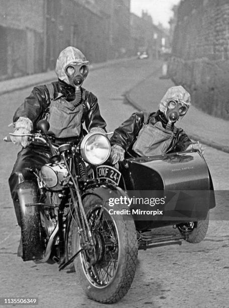 Air raid wardens seen here riding on a motorbike and sidecar during an air raid gas exercise on Merseyside 18th January 1938.