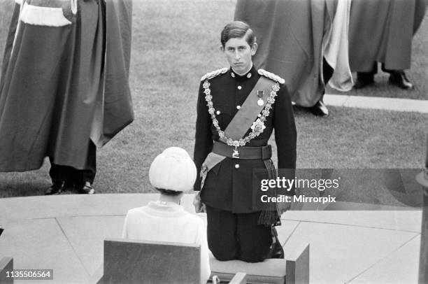 The Investiture of Prince Charles at Caernarfon Castle, Caernarfon, Wales, Prince Charles kneels before the HRH Queen Elizabeth II, 1st July 1969.