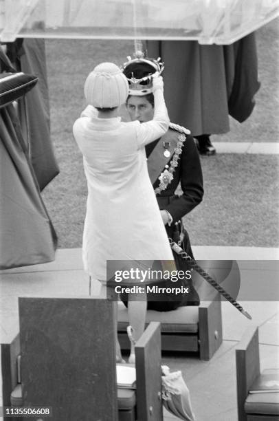 The Investiture of Prince Charles at Caernarfon Castle, HRH Queen Elizabeth II places the crown on the head of Prince Charles, Caernarfon, Wales, 1st...