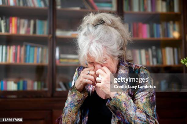 senior woman visiting a senior counselor - weinen stock-fotos und bilder