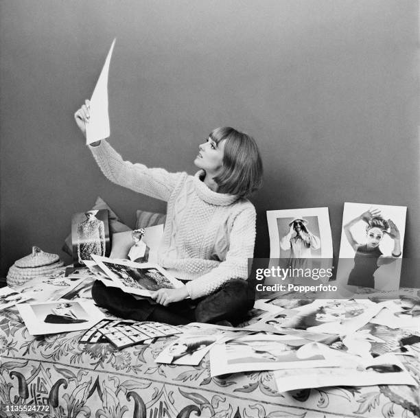 Welsh model Grace Coddington pictured looking at photographic prints from modelling shoots in London in February 1964. Grace Coddington has...