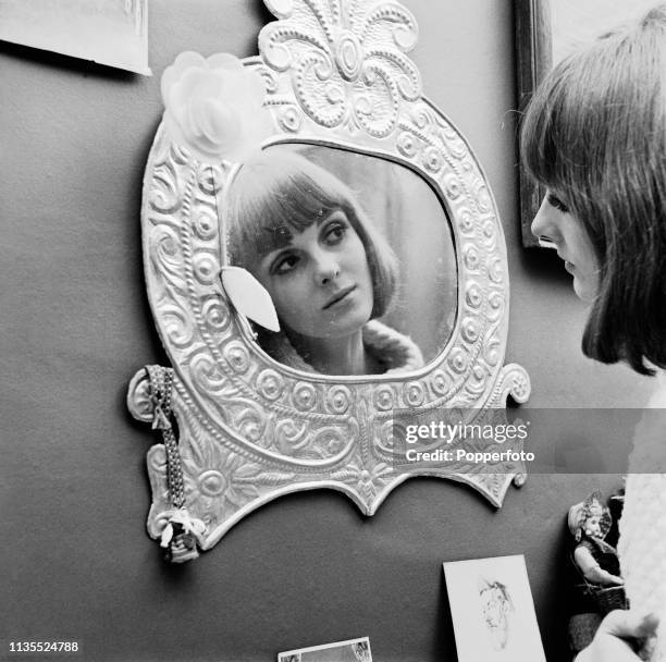 Welsh model Grace Coddington pictured looking at her reflection in a mirror in London in February 1964. Grace Coddington has successfully resumed her...