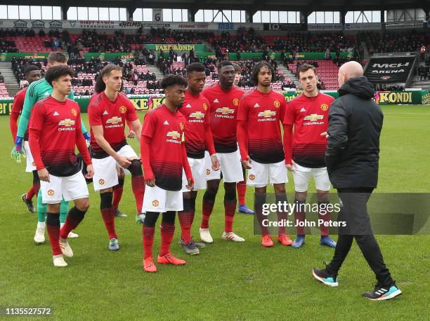 Manager Nicky Butt speaks to the Manchester United U19 team ahead of the UEFA Youth League match between Midtjylland U19s and Manchester United U19s...