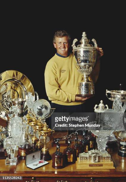 Colin Montgomerie of Great Britain poses with his golfing trophies and cups on 8 November 1999 United Kingdom.
