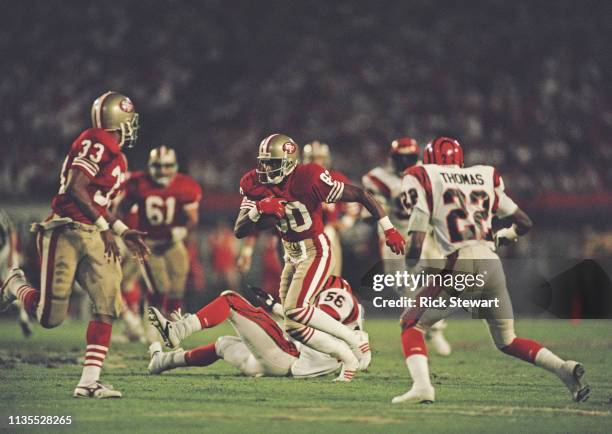 Jerry Rice, Wide Receiver for the San Francisco 49ers runs the ball during the National Football League Super Bowl XXIII game against the Cincinnati...