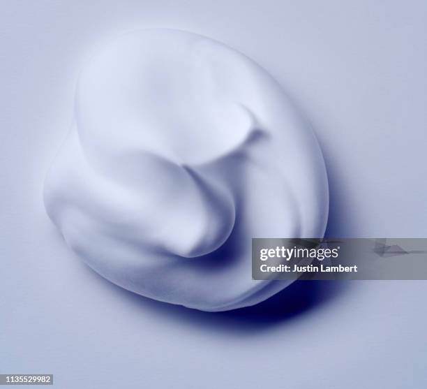 creamy swirl of foam on white with slight blue tinge - bubble soap foto e immagini stock