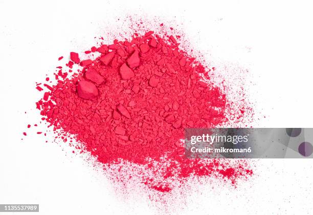 pink/ red pile of pigment powder on a white background - vernice in polvere foto e immagini stock