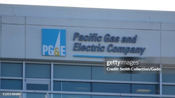 Close-up of logo atop headquarters of utility company Pacific Gas and Electric in San Ramon, California; the company faced bankruptcy in 2019...